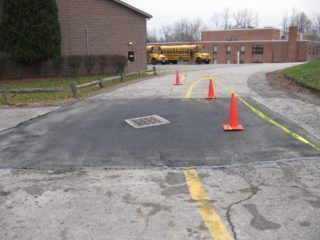 A picture of a catch basin repair at a local school.